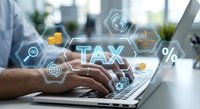 Professional accountant working on laptop with digital tax management interface overlay featuring financial icons and percentage symbols in modern office.