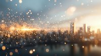 Blurred urban skyline at sunset with glowing bokeh particles and light effects creating magical atmosphere. Suitable for background and composites.