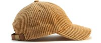 Camel beige corduroy baseball cap with leather strap isolated on white background, side view, casual fashion accessory for autumn and winter.