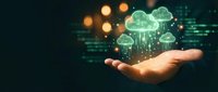 Hand holding glowing cloud computing icons with data streams and digital network connections for technology and business solutions.