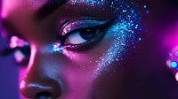 Close up portrait with neon pink and blue glitter makeup artistry, dramatic eye detail with sparkles and metallic effects in dark atmospheric lighting.