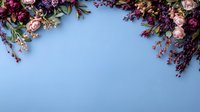 Floral frame border with pink roses and purple wildflowers on light blue background, creating elegant composition with copy space for text or design elements.
