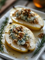Sliced pears topped with blue cheese crumbles and walnuts on white plate with rosemary garnish for gourmet appetizer or dessert presentation.