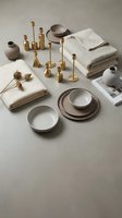 Minimalist home decor flat lay with neutral ceramic dinnerware, brass candlesticks, linen towels and dried flowers on beige background for interior design.