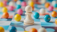 White wooden chess pawn surrounded by colorful beads on blue surface, shallow depth of field composition showing strategy and uniqueness concept.