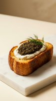 Toasted bread slice topped with creamy spread and luxurious caviar garnished with fresh dill on marble board, gourmet appetizer for fine dining and upscale culinary presentations.