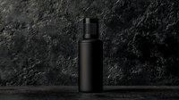 Minimalist black cosmetic bottle on dark textured background with dramatic lighting. Luxury skincare packaging mockup isolated for beauty product design.