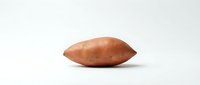 Single russet potato with smooth skin isolated on white background, suitable for food photography, culinary content, grocery retail, nutrition education, and cooking websites.