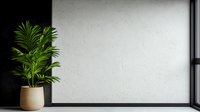 Minimalist interior with green palm plant in beige ceramic pot against white textured wall and black window frame, modern home decor styling.