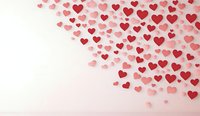 Red and pink heart shapes scattered on white background, creating romantic pattern with copy space for Valentine's Day messages or love-themed designs.