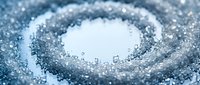 Sparkling salt crystals arranged in a circular swirl pattern on white background, isolated for culinary, seasoning, and food design projects.