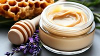 Luxurious honey cream moisturizer with lavender flowers and honeycomb, natural organic skincare product in glass jar, cosmetic beauty photography.