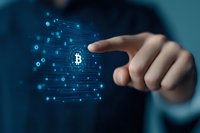 Businessman pointing at digital Bitcoin symbol with glowing network connections, representing cryptocurrency investment and blockchain technology.