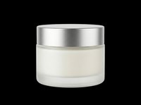 Cosmetic jar with cream or moisturizer inside, featuring frosted glass container and metallic silver lid, isolated on transparent background ready for skincare product design, packaging mockups, e-commerce, and print materials.