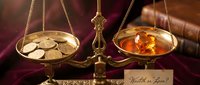 Vintage brass balance scale weighing gold coins against amber gemstones with wealth or love card, symbolizing choice between money and passion.