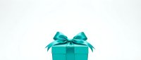 Turquoise gift box with satin bow isolated on white background, ready for holiday, birthday, and celebration design projects.
