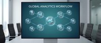 Global analytics workflow displayed on conference room monitor with connected data icons and network nodes representing business intelligence and digital transformation strategy.