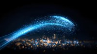 Glowing blue light trail with sparkling particles over blurred city lights at night, creating magical energy flow effect against dark urban backdrop.