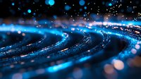 Glowing blue spiral pattern with shimmering bokeh lights and sparkles on dark background creates mesmerizing abstract composition for technology designs.