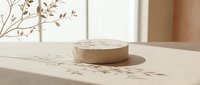 Minimalist wooden podium with natural branch shadows on neutral beige surface for product display and branding presentations in modern interior design.