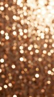 Rose gold glitter bokeh background with shimmering golden light circles, perfect for festive, luxury, and holiday designs.
