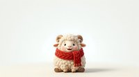 Cute sheep figurine wearing red scarf, standing against neutral background. Suitable for holiday decorations, greeting cards, children's content, and festive marketing materials.