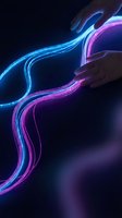 Human hands manipulating flowing neon light streams in blue and purple colors against dark background for digital technology and innovation concepts.