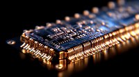 Macro shot of electronic microchip with golden pins and circuit paths illuminated dramatically against dark background, showcasing modern semiconductor technology.
