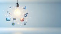 Business innovation concept with glowing lightbulb and floating icons representing strategy, finance, technology and growth on clean background.