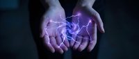 Hands holding glowing purple electric energy and lightning bolts on dark background for technology, power, and innovation concepts.