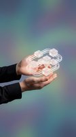 Hands of male professional holding glowing neon network nodes and connected lines, representing digital transformation, data connectivity, and blockchain technology for business solutions.