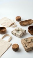 Wooden bowls, storage containers, and kraft paper gift boxes arranged with cotton tote bags on white background for sustainable lifestyle and eco-friendly shopping concepts.