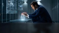 Businessman in dark suit interacting with holographic security lock interface in modern data center server room with blue lighting for cybersecurity concepts.