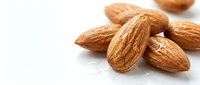 Whole raw almonds with shells isolated on white background, suitable for food, nutrition, and healthy eating content.