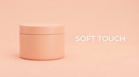 Cylindrical cosmetic jar with lid on soft peachy background, suitable for skincare product packaging mockups and beauty branding designs.