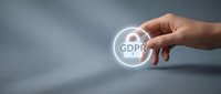 Hand touching glowing GDPR icon representing data protection compliance and privacy regulations for business security concepts.