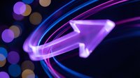 Neon glowing arrow pointing upright with purple and blue light trails on dark background, suitable for growth, success, direction and technology concepts.