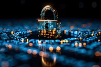 Glowing padlock on circuit board with blue bokeh lights reflects cybersecurity and digital data protection concept against dark background.