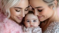 Tender family moment with baby between two women in pink and silver attire, expressing love and connection through gentle embrace and soft smiles.