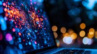 Glowing laptop keyboard with colorful bokeh lights in dark background creates atmospheric night mood, digital technology concept for business and creativity.