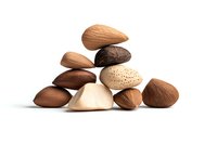 Mixed nuts collection arranged in balanced composition on white background, including almonds, brazil nuts and pecans. Isolated food photography for packaging design.