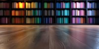 Empty wooden floor with blurred colorful bookshelf background creating atmospheric perspective. Multicolored library interior with dramatic lighting and depth of field.