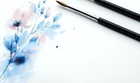 Delicate watercolor floral composition in soft blue and pink tones with art brushes on white background, suitable for stationery design and artistic projects.