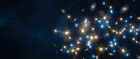 Sparkling star cluster with bright golden and blue lights against deep space background for astronomy and cosmic themed designs.
