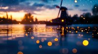 Traditional windmill silhouette at sunset with magical bokeh lights reflecting on water surface, dreamy twilight landscape with starry sky and glowing orbs.