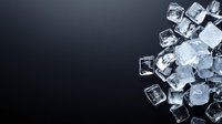 Clear ice cubes scattered on dark background with dramatic lighting and copy space, frozen water crystals creating minimalist composition for beverage and cocktail designs.