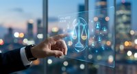Digital justice scales hologram activated by businessman hand against city skyline background representing legal technology and law firm innovation.