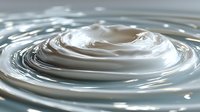 Clear water ripples creating concentric circles with smooth surface tension and natural light reflections for spa wellness and purity concepts.