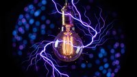 Vintage Edison bulb with electric lightning bolts and purple energy discharge on dark background with bokeh lights for creative design projects.