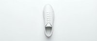 White leather sneaker isolated on white background, top view. Minimalist casual footwear for fashion, sport, and lifestyle design projects.